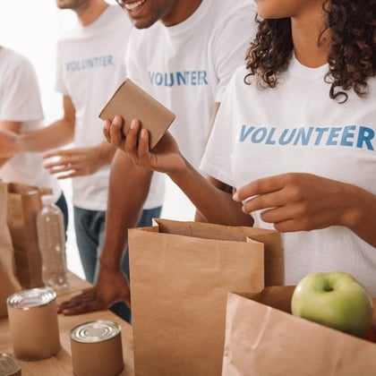 Volunteers packing food for charity